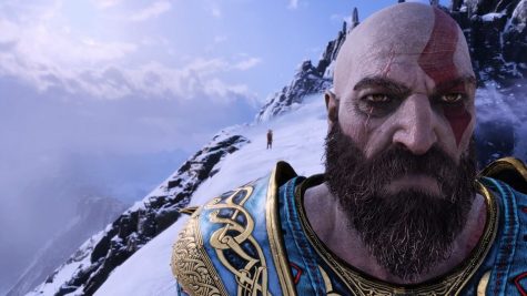 A stone-faced Kratos crosses the peak of a mountain with his son, Atreus, in Santa Monica Studio’s PlayStation 4 masterpiece God of War.