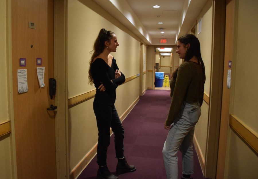 College sophomores Madeleine Faubert (left) and Jessie Julian (right) converse in Disability Solidarity Hall.