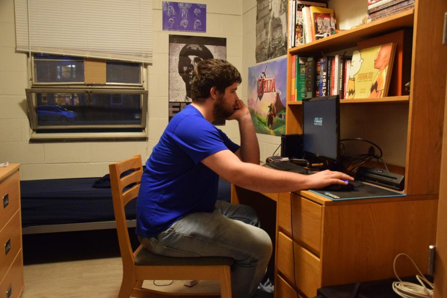 College sophomore James Dryden sits in his Langston Hall dorm room. Langston and other dorms experienced a string of thefts in recent weeks.