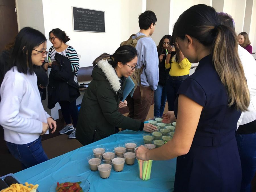College sophomore Katie Kim passes out boba outside of Warner Concert Hall. Kim runs a small business Bobalin which she started last year after getting an honorable mention and $2,000 in the LaunchU competition. 