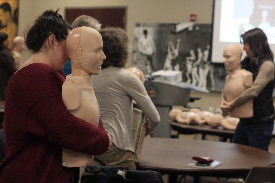 Students practice cardiopulmonary resuscitation procedures on both infant and adult CPR manikins during a free University Hospital instructional course hosted by the Oberlin Sports Medicine Department last Monday. Oberlin students, faculty, and staff arrived at the Knowlton Athletics Complex Social Space at 6 p.m. to learn various life-saving techniques to prepare for a potential emergency situation. At least two members of each Oberlin club-sport team were encouraged to attend, along with other organizations on campus that openly recommended the training. The event was attended by over 70 people — many more than the expected 40.