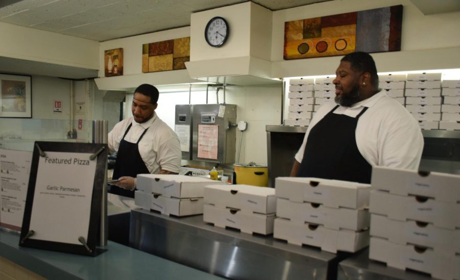 CDS workers prepare pizzas in the Wilder DeCafé. Hourly employees continue to express concerns over the impacts of the AAPR recommendations.