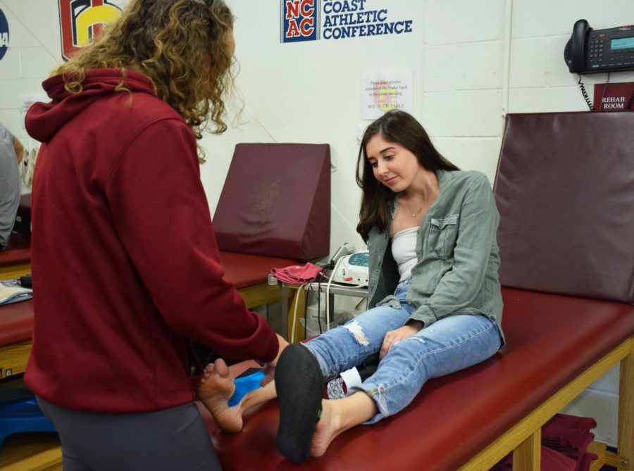 College third-year Tess Siciliano, women’s lacrosse player, gets her ankle rehabilitated.