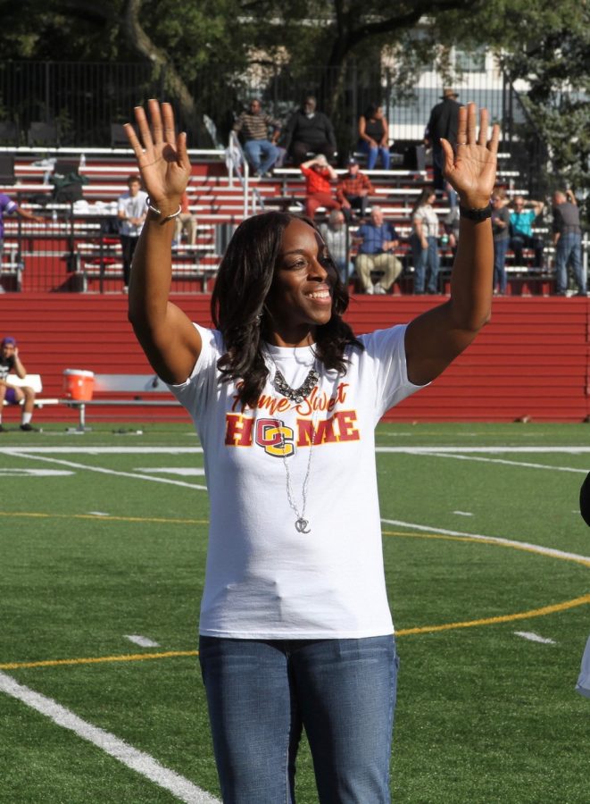 President Carmen Twillie Ambar on the field at halftime of the Homecoming football game.