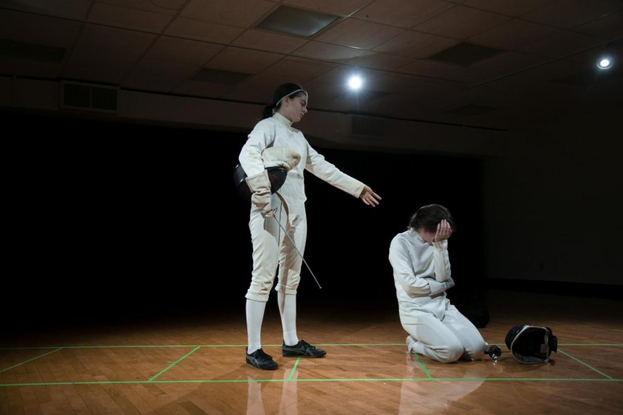 College second-year and Theater major Clara Zucker wanted to put on a play with two of her friends, College second-years Jane Hobson and Claudia Kelly — she just needed to figure out what the play should be. Her high school drama teacher recommended Athena, a play about high schoolers Mary Wallace and Athena, two fencers training for the Junior Olympics
“After fencing each other for the first time, [Mary and Athena] happen upon an unlikely friendship,” Hobson, who plays Mary Wallace, wrote in an email to the Review. “The rest of the play follows the growth of that relationship.”
Athena follows the pair as they train together for the Junior Olympic Fencing Tournament.
“It’s about maintaining a relationship in the face of competition,” Zucker explained.
Zucker decided to produce her own show this semester, without backing by the department or by a student group like the Oberlin Student Theater Association. The set is simple, there are minimal props, and the department agreed to cover the cost of the playbills.
“It’s not an expensive show, and since we’re not selling tickets we didn’t have to buy the rights,” Zucker said. Additionally, shows that are not affiliated with a larger office or organization don’t have the same requirements for purchasing rights.
Of course, putting on a show without that institutional support requires a versatile director and a legion of supporters — Oberlin’s fencing club supplied costumes, Zucker’s friends College second-years Noah Plotkin and Anisa Curry-Vietze are helping to run the lights, and College second-year Josh Turner is doing the sound design, among others.
“[College second-year] Katie Kunka has been coming in during this week and helping,” Zucker said. “She’s just acting as a fresh pair of eyes and giving me some notes and giving the actors notes, which is nice.”
Zucker became interested in directing through the theater program at her high school, where she was able to take a directing class and later put on Annie Baker’s Circle Mirror Transformation. While at Oberlin, Zucker plans to complete a directing concentration within her Theater major.
“Coming from being a senior in high school to then a first-year, I was like, ‘Oh, I need to find some way to feel old or feel in control of something,’” she laughed. “And I think directing really allows me to do that.”
Athena will run Friday, Nov. 8 and Saturday, Nov. 9 at 8 p.m. in South Studios. Tickets are free.