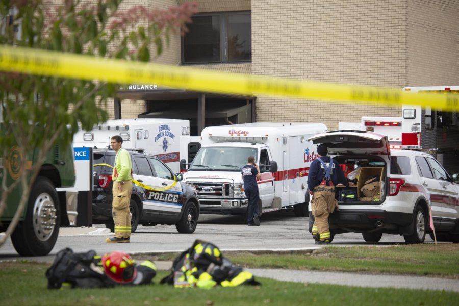 Emergency responders stand outside of Mercy Allen Hospital on Tuesday after seven people were exposed to an unknown substance.