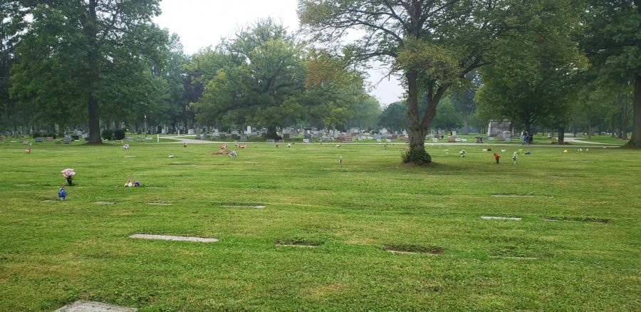 Flat gravestones are sinking into the ground in Section S of Westwood Cemetery.