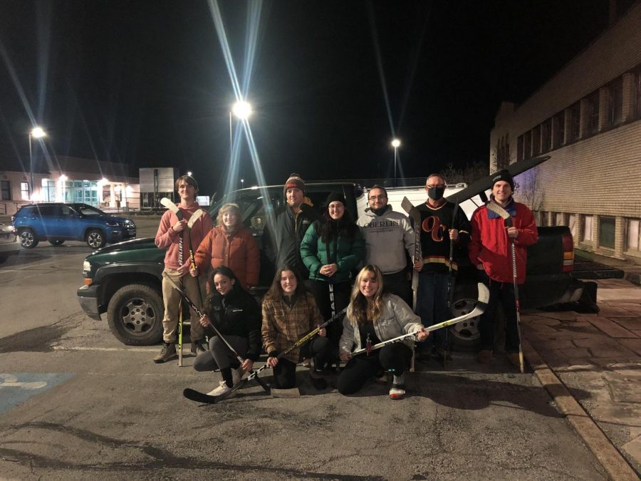 Oberlin’s club hockey team, the Plague, poses with its sticks.