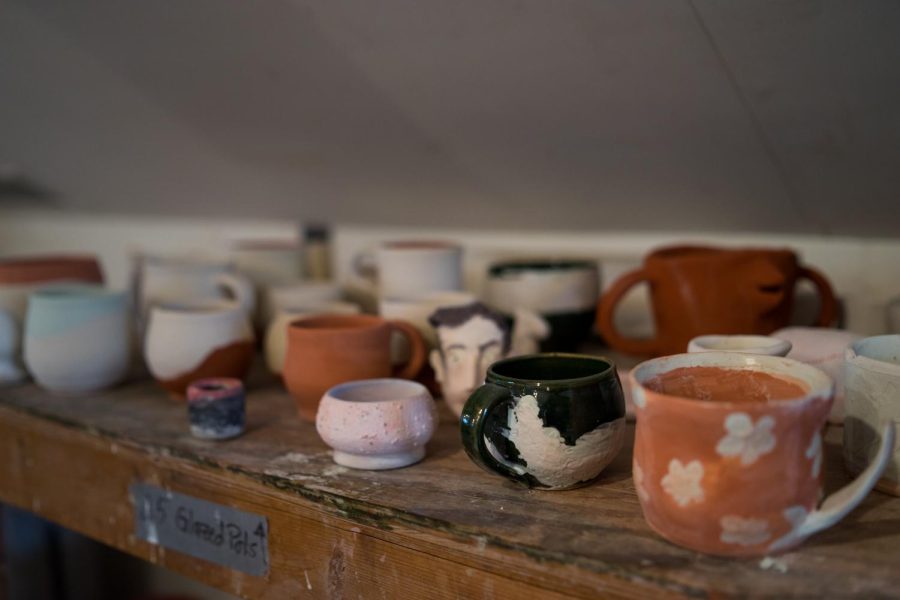Mugs in the Pottery Co-op. Photo by Abe Frato.