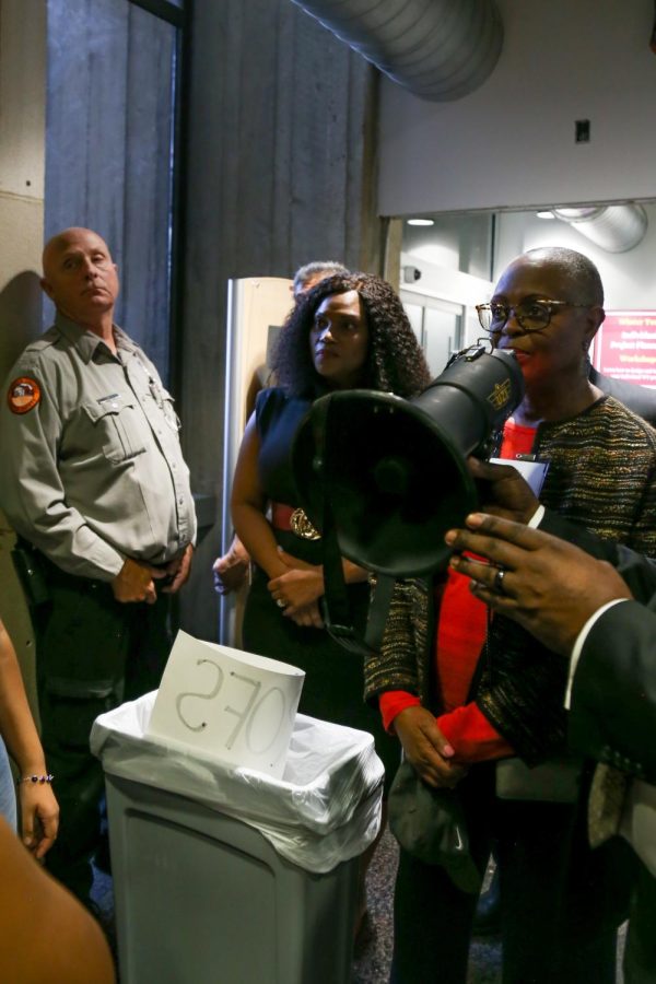 Vice President and Dean of Students Karen Goff, Vice Chair of the Board of Trustees Lillie Edwards, and security stood in the entryway to CELA, with a trash can creating a barrier between themselves and student protestors. 