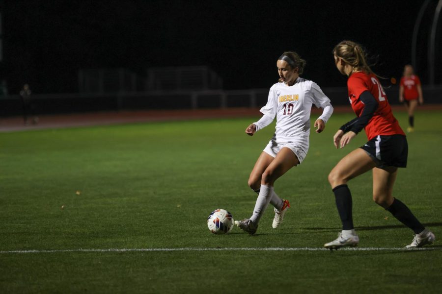 Heather Benway dribbles in a game against Denison University