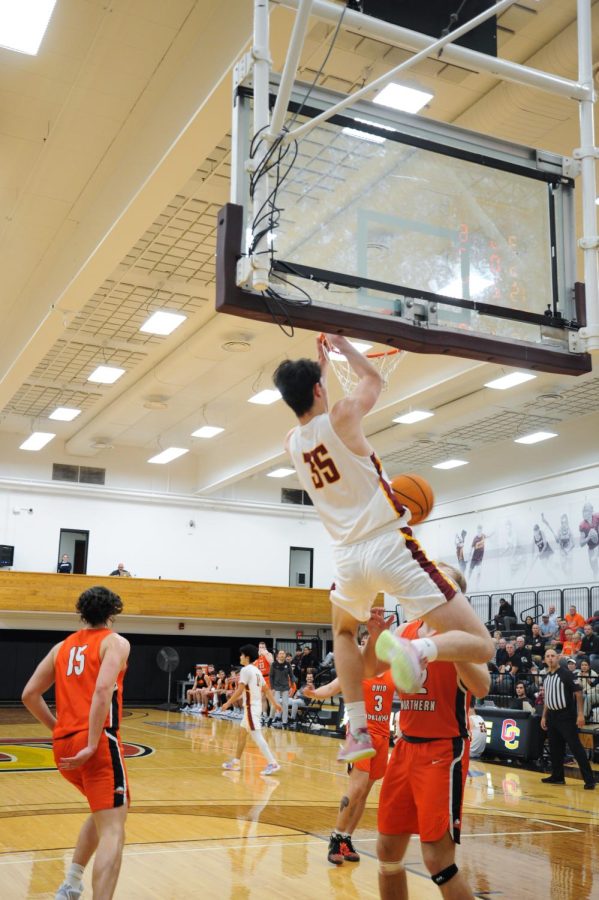 Milun Micanovic makes a slam dunk in a game against Ohio
Northern University on Tuesday.