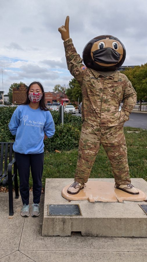 Kayla Kim poses with a statue of Brutus Buckeye at The Ohio State University
in October 2020.