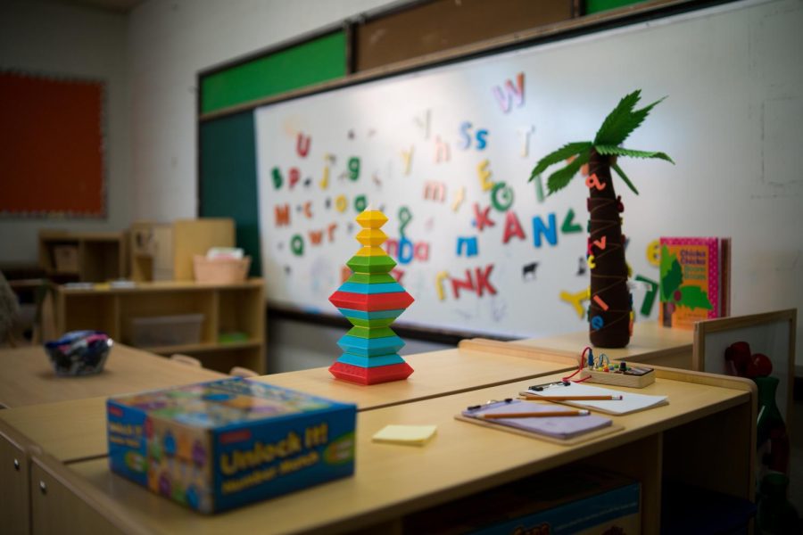 The classroom features toys, crafting supplies, and other activities for visitors.