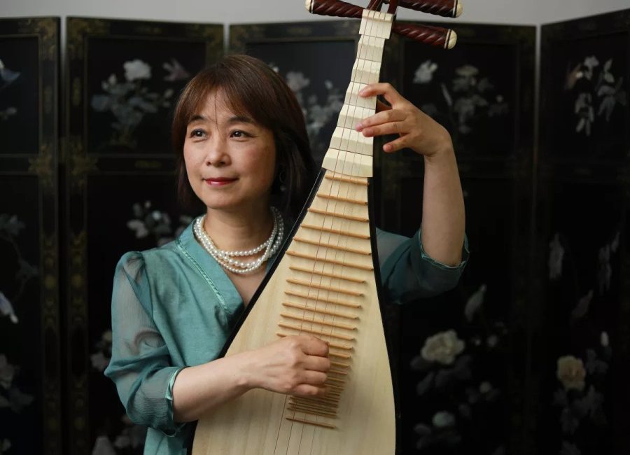 Wu Man plays the pipa, a traditional Chinese instrument.