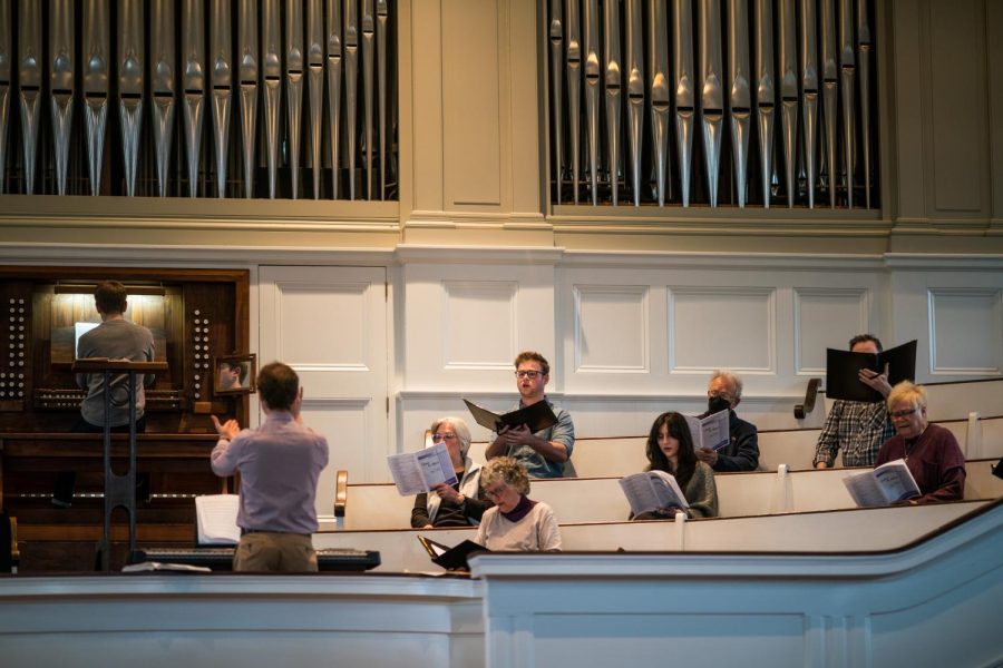 Students rehearse with community members in a local church choir. 