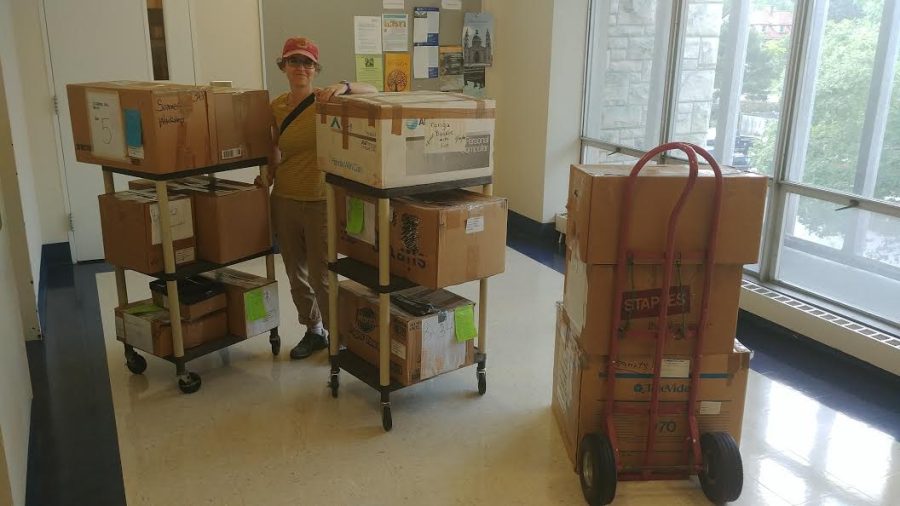 Amy Margaris works to move specimens from the ethnographic collection to Mudd Center.