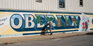 Oberlin Community Mural Project works on new mural in town.
