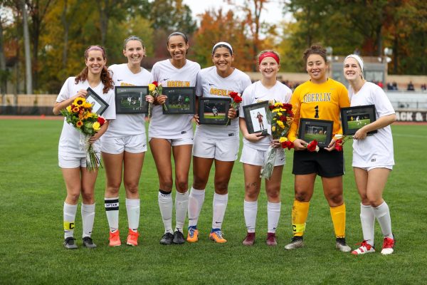 Seniors on the women’s volleyball, women’s soccer, and men’s soccer teams celebrate.
