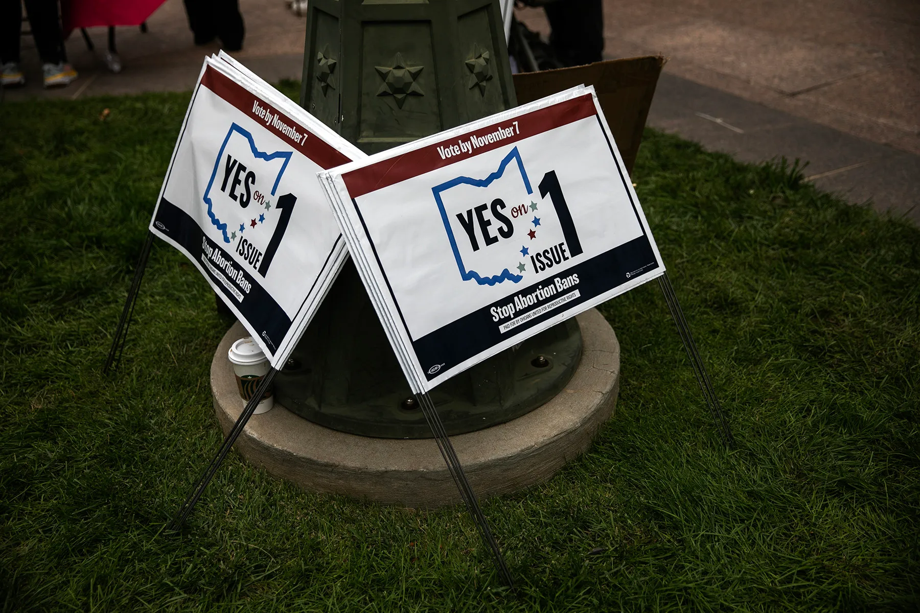 Signs encourage voters to vote yes on Issue 1 this November.