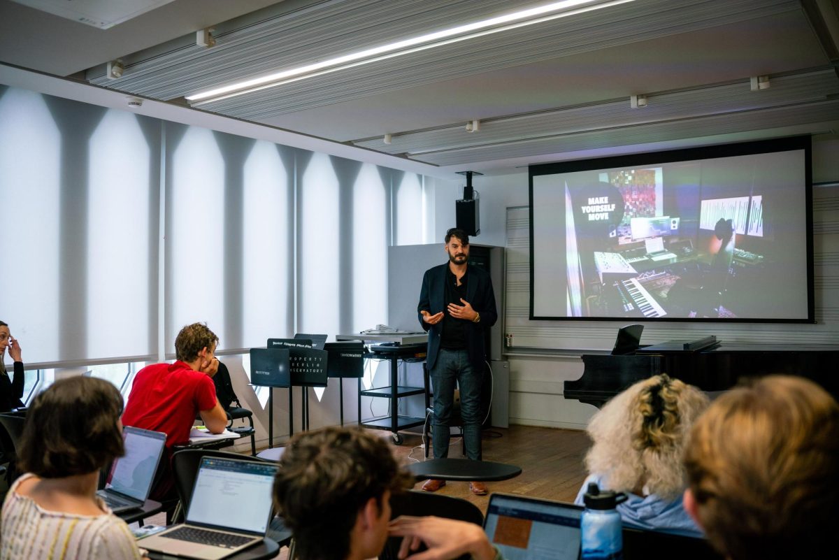 Aaron Helgeson, OC ’05, leads a workshop on creative wellness.