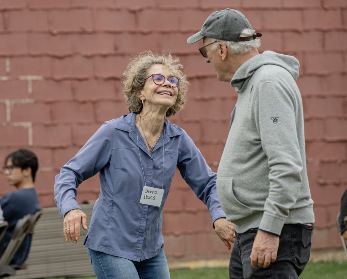 Devra Davis and Richard Morgenstern, OC ’66, dance at Saturday’s Heisman Club Homecoming Tailgate.