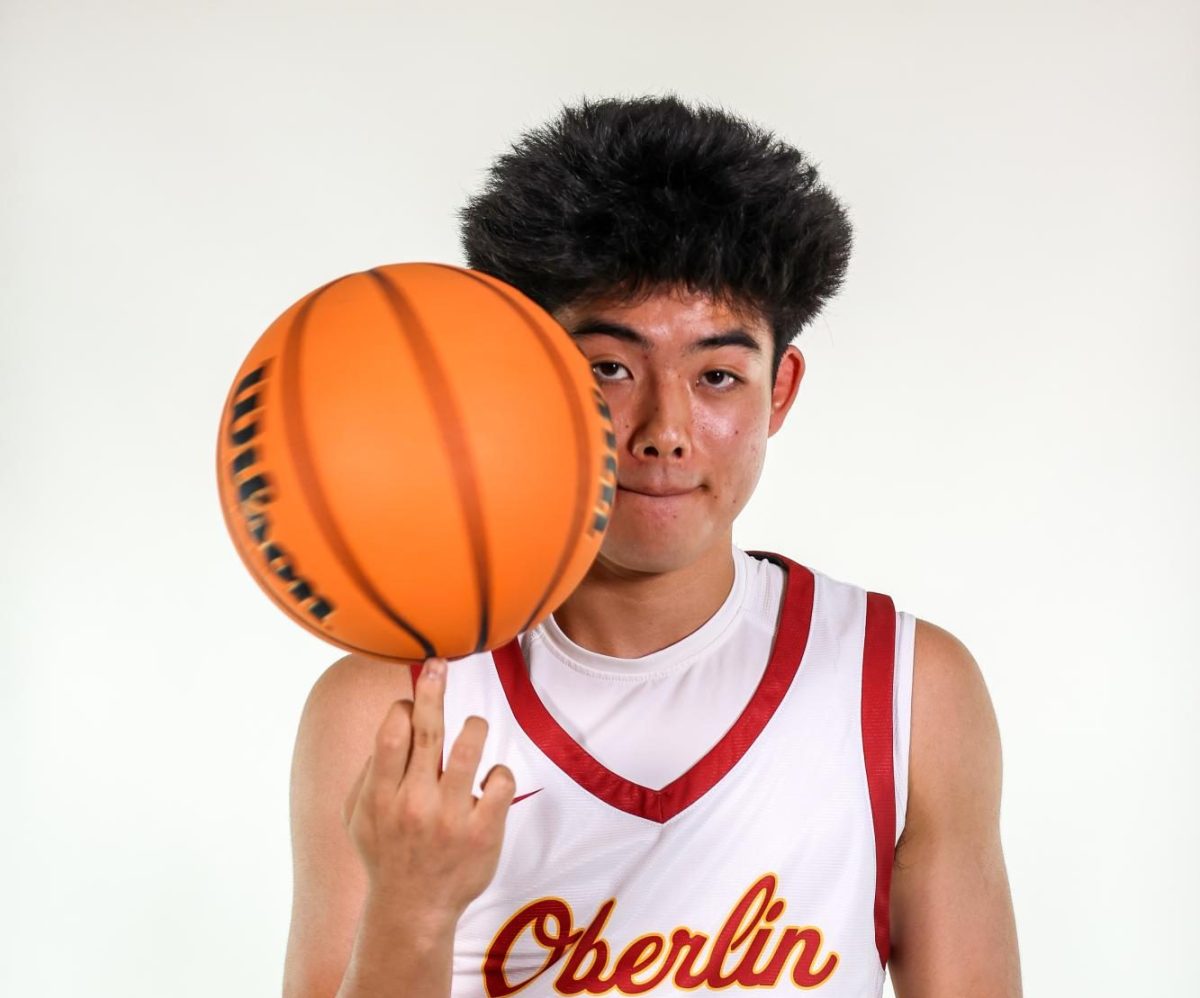 Yuuki Okubo spins basketball on finger at media day.