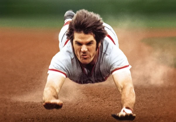 Pete Rose shows off his iconic superman dive into third base.