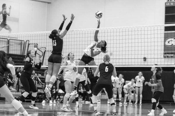 Cami Sweet tips the ball at the game against The College of Wooster.