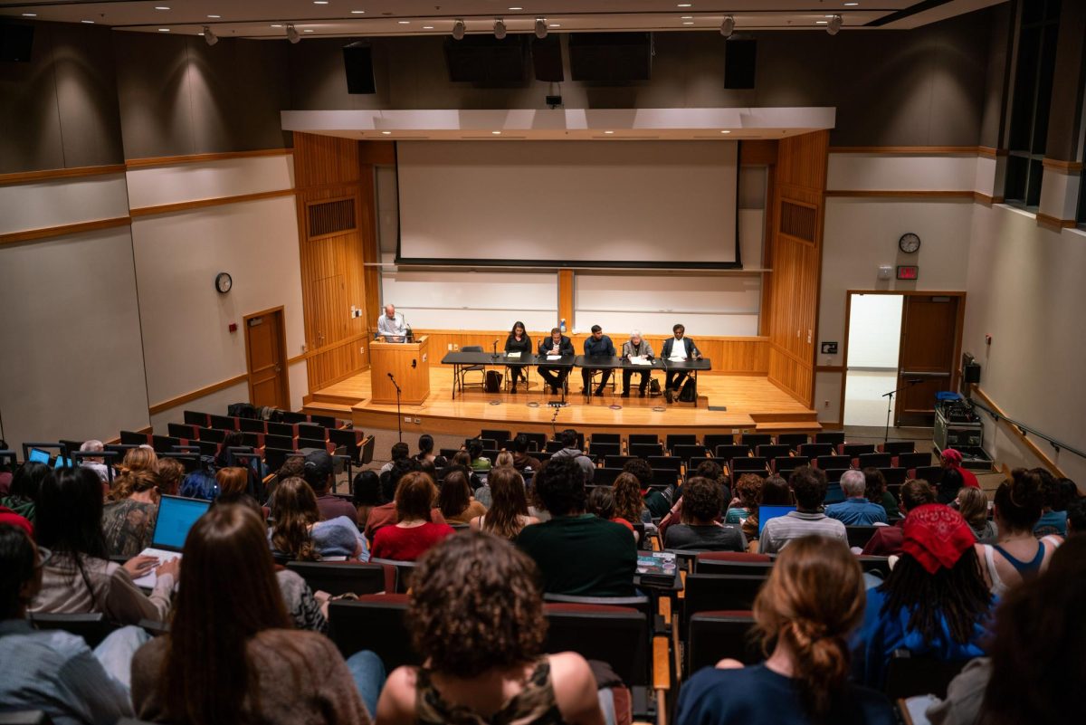 Students attend a faculty panel discussing the possible effects of a Trump presidency Wednesday.