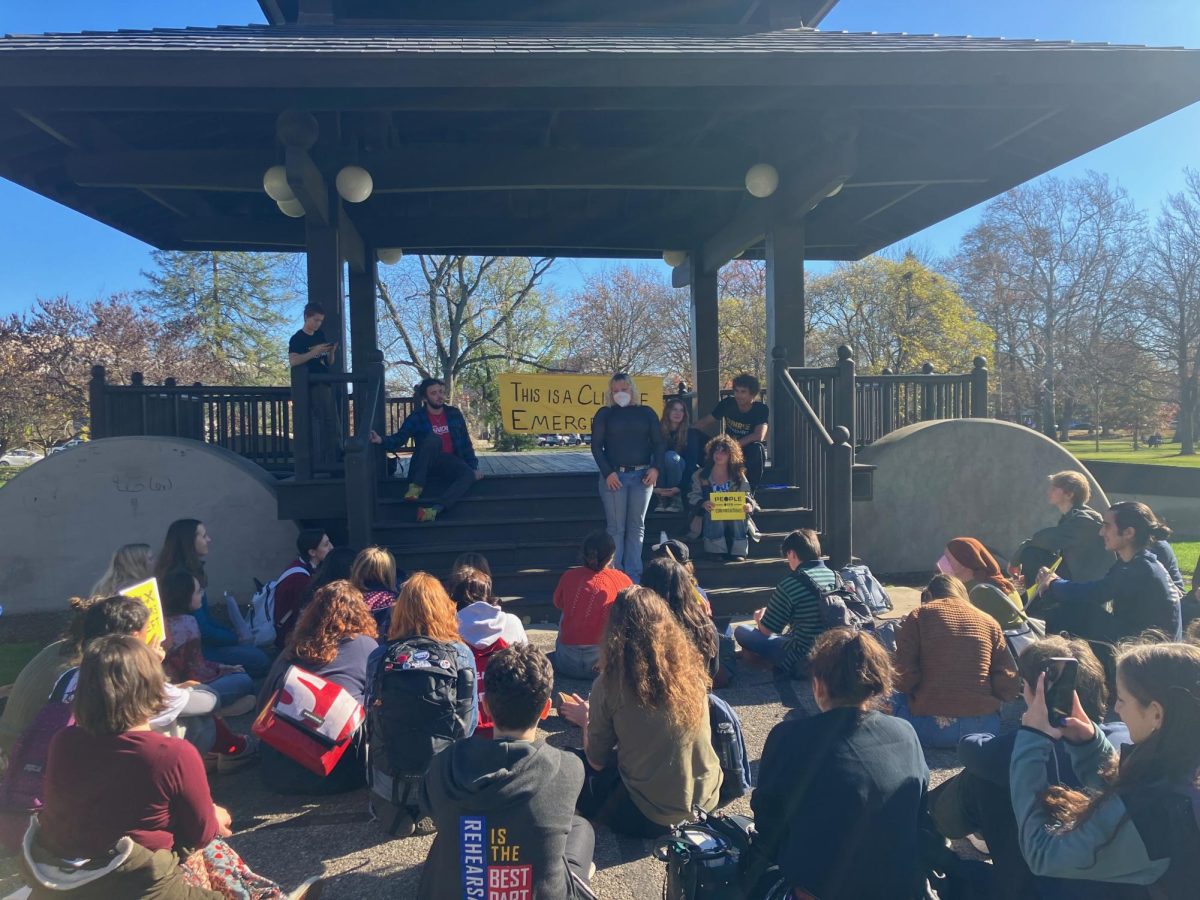 Students listen to speakers at Tappan Bandstand during friday’s Sunrise Protest.