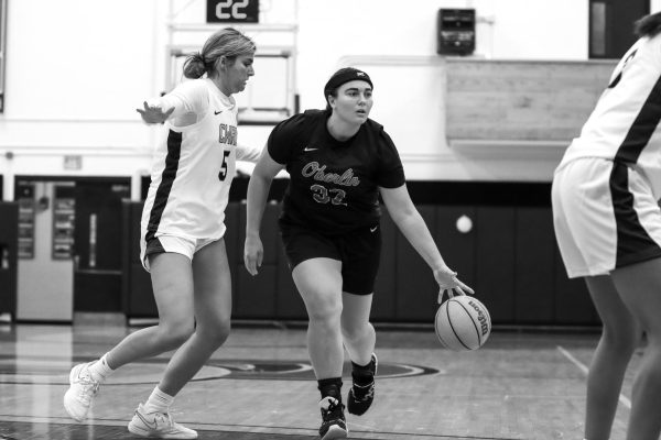 Fourth-year forward Camille Zinaich dribbles up the court in a scrimmage against Case Western University. 
