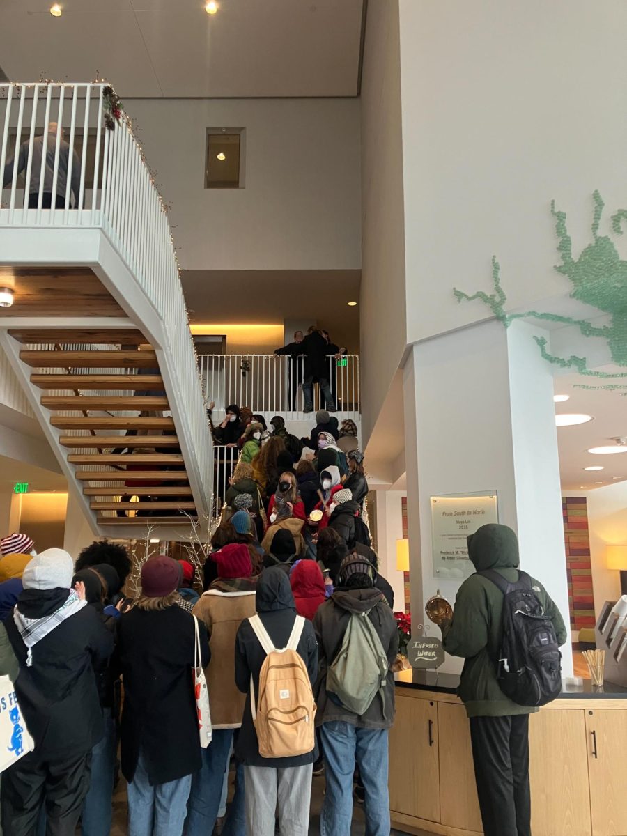 Protestors fill the stairwell in The Hotel at Oberlin during the Board of Trustees Investment Committee meeting.