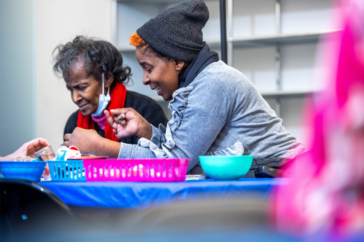 Patient Alice and her mother work in the Holiday Pop-Up Art Therapy Studio.