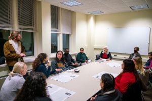 Students speak with Dr. Washburn at a MENA program event.