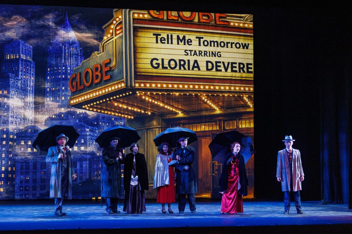 Characters linger outside the theater in Later the Same Evening.