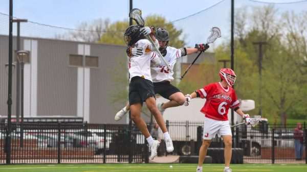 Men's lacrosse celebrate a goal against Denison University.